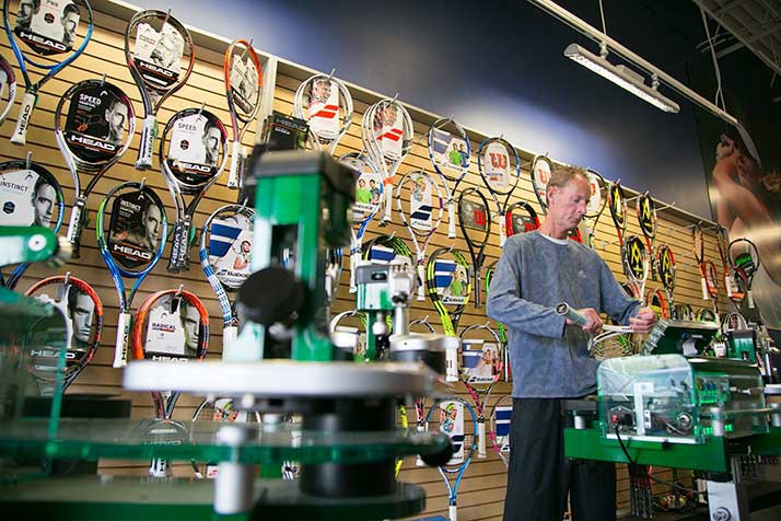 Matt Rodney strings up a racquet at The Tennis Set in Overland Park.
