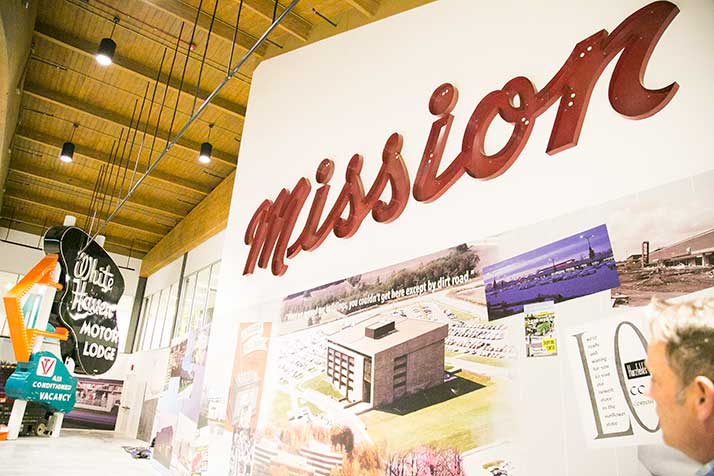 A sign from the original Mission Shopping Center hangs prominently on the museum walls.