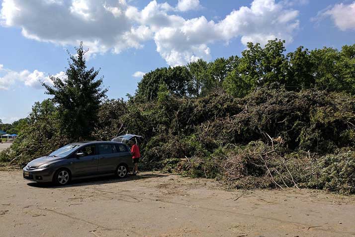 The storm debris pile at Young's Pool in Overland Park had grown several feet high Tuesday. Photo via city of Overland Park.