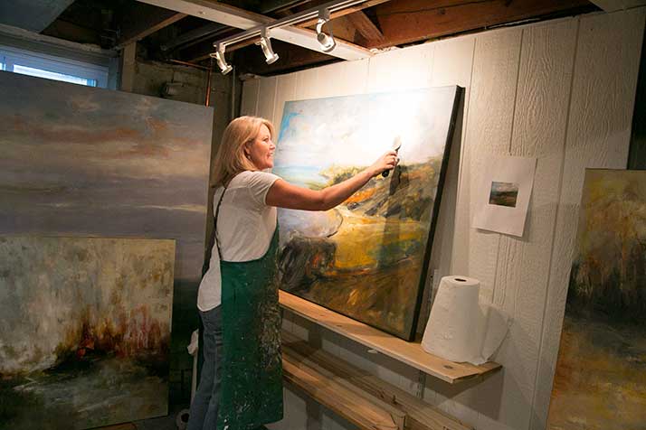 Becky Pashia at work in her basement studio in Leawood. She recently launched a media company that's publishing interactive storybooks for kids.