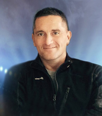 Santos Thompson was killed in the driveway of his family's home in Merriam in August.
