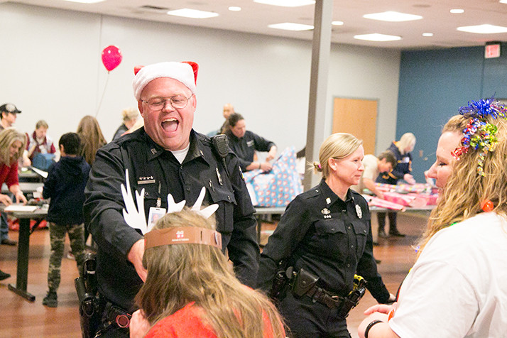 Officers helped the students decorate cookies for their families' holiday celebrations.