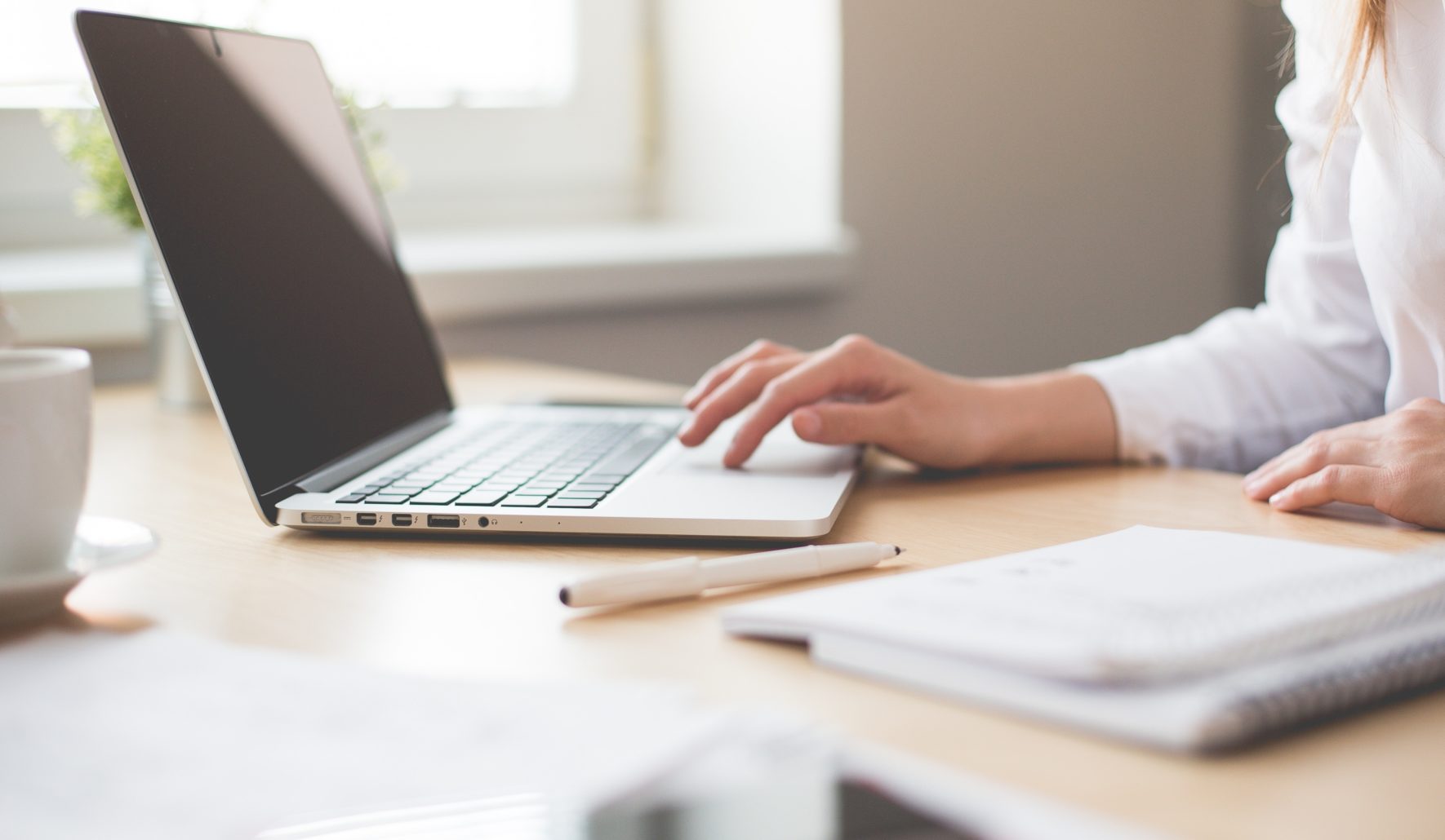 woman writing notes for oracle cloud implementation best practices