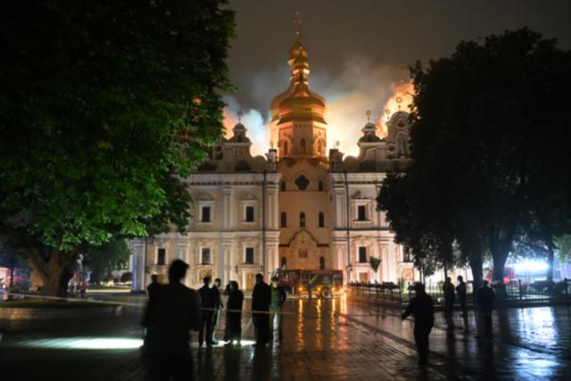 Russian attack sets fire to centuries-old religious site in Kyiv and kills rescuers in Kharkiv