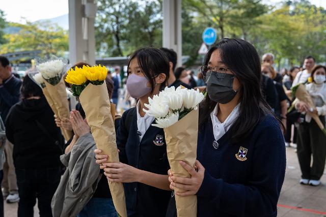 AP News: Hong Kong fire probe reveals unsafe netting as public mourns and government stifles dissent