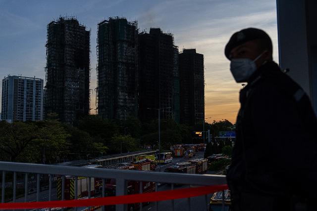 AP News: Death toll rises to 128 in Hong Kong residential fire; 8 more arrested over towers' renovation