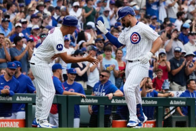 Former Cubs player Anthony Rizzo snares Michael Busch's home run ball in the Wrigley Field bleachers