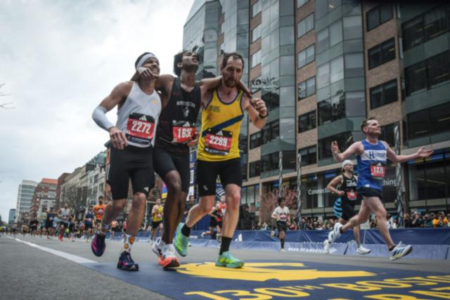 AP News: Man who helped fellow runner across Boston Marathon finish line says it was natural instinct to help