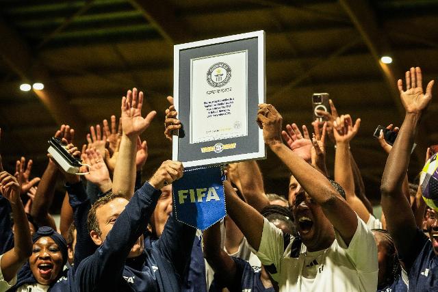 AP News: FIFA co-workers break Guinness World Record for most multinational soccer game