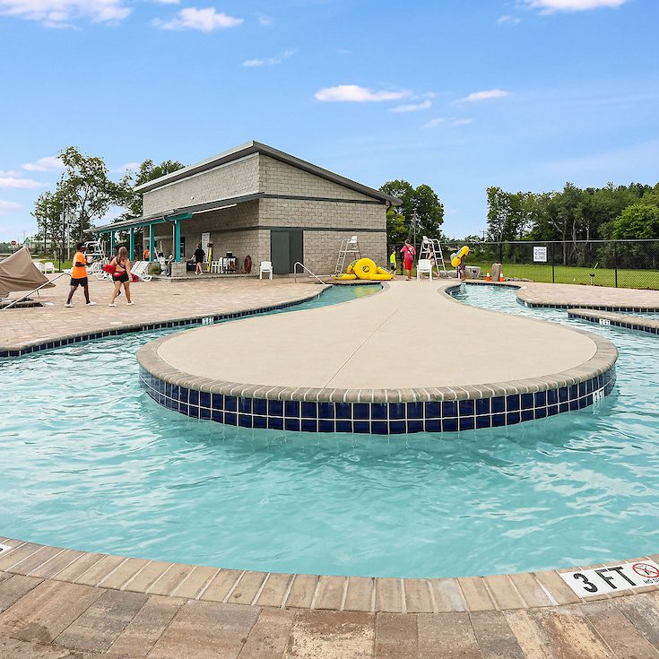 Photo of a lazy river with yellow inflatable rings at the Burke County YMCA