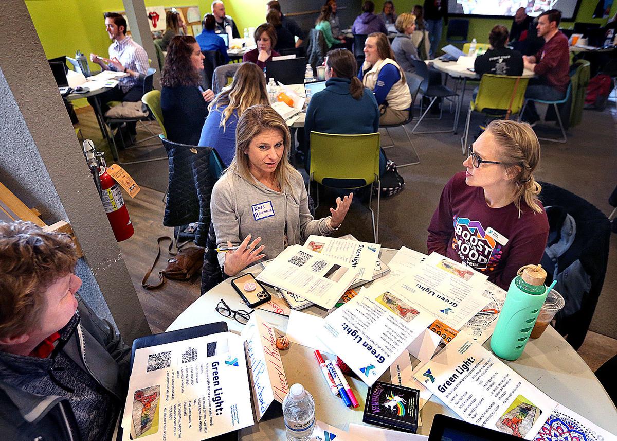 women sitting around table at training event