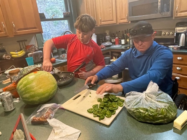 Geoff and Carver cooking in the kitchen