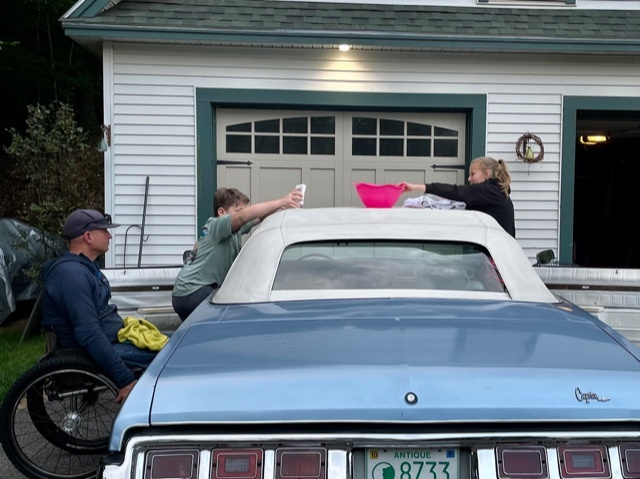 Krill family washing their 1973 blue Chevy 