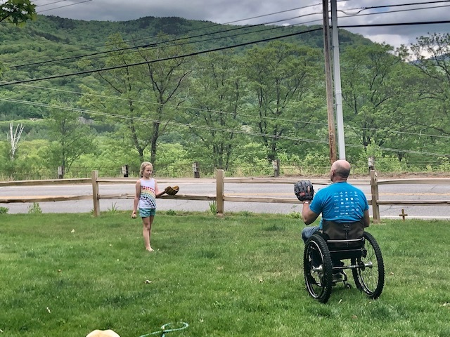 Geoff Krill playing catch with daughter