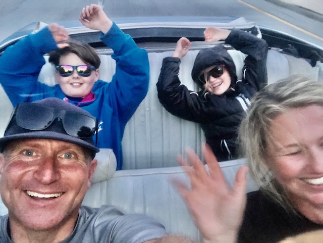 Krill family riding in convertible