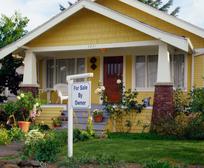House With a For Sale By Owner Sign