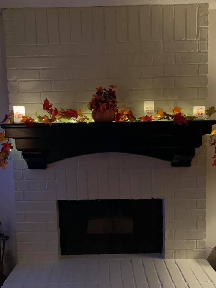 Fireplace Photo with fall decor will soon have family photos displayed as well