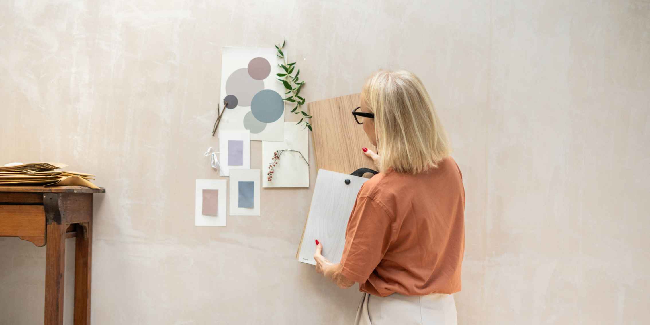 Interior Designer Using Colour Palette Mood Board image showing interior designer working with colour palletes.