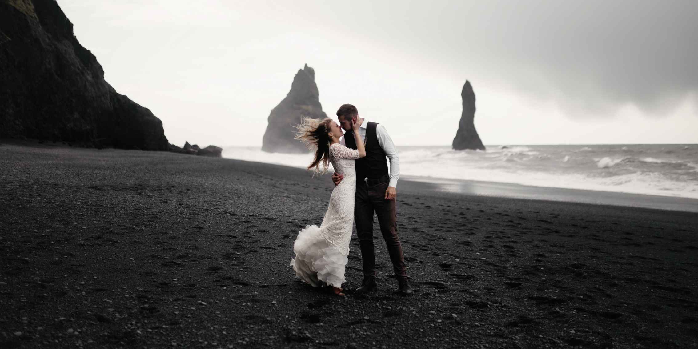 Overcast and softlight wedding shot dramatic wedding shot of a husband and wife on an overcast and atmospheric beach