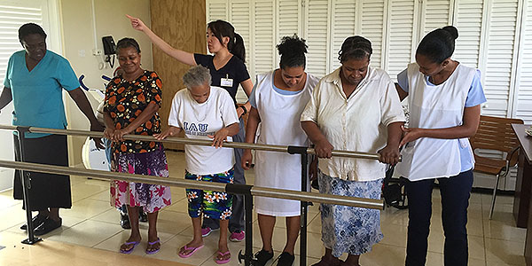 Doctor of physical therapy student Cydney Lee, CHP &rsquo;16, leads an exercise session for patients at Comfort Bay, a home for seniors in Vieux Fort, Saint Lucia.