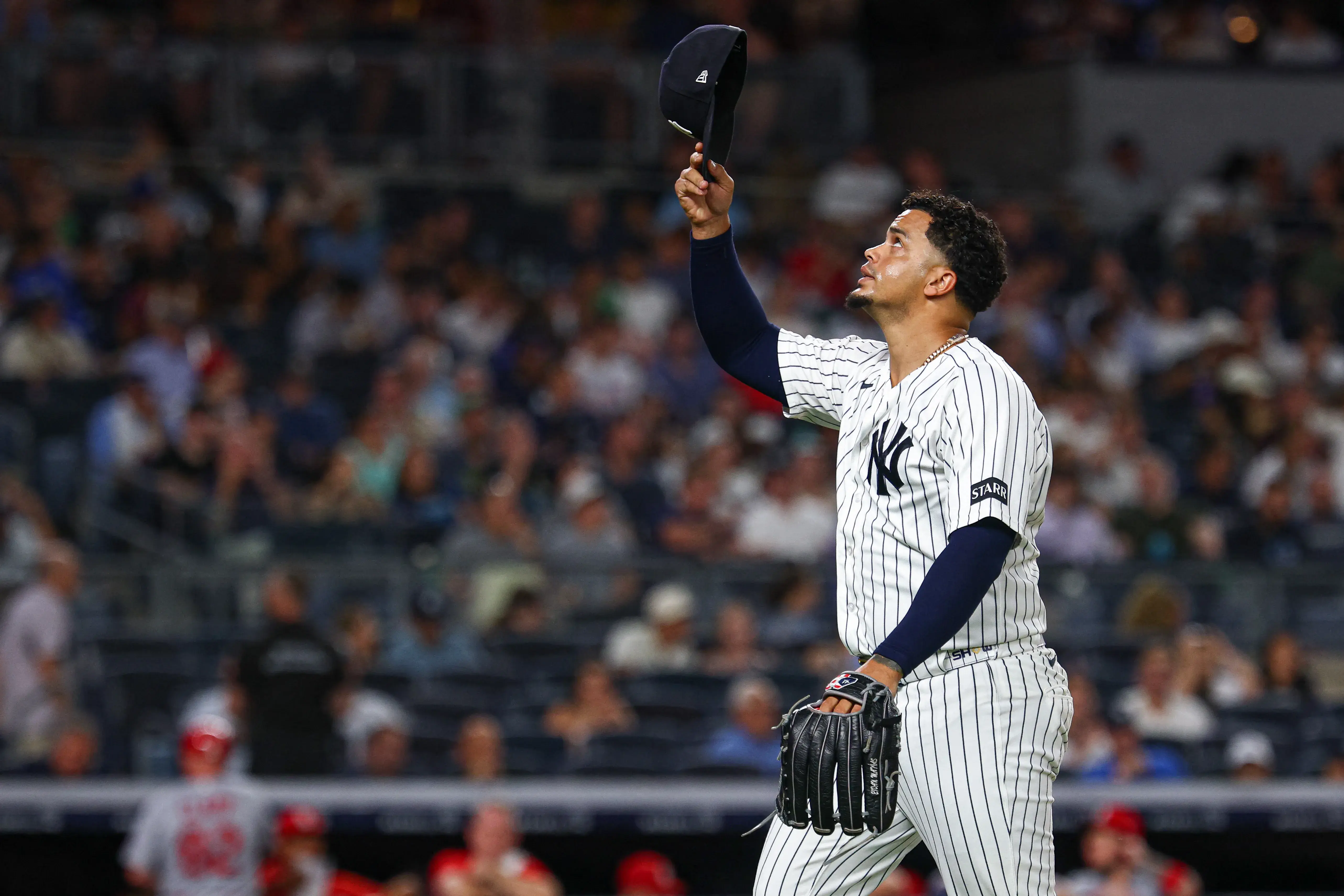 New York Yankees pitcher Fernando Cruz (63) reacts after being taken out of the game during the seventh inning against the St. Louis Cardinals at Yankee Stadium. Mandatory Credit: Vincent Carchietta-Imagn Images