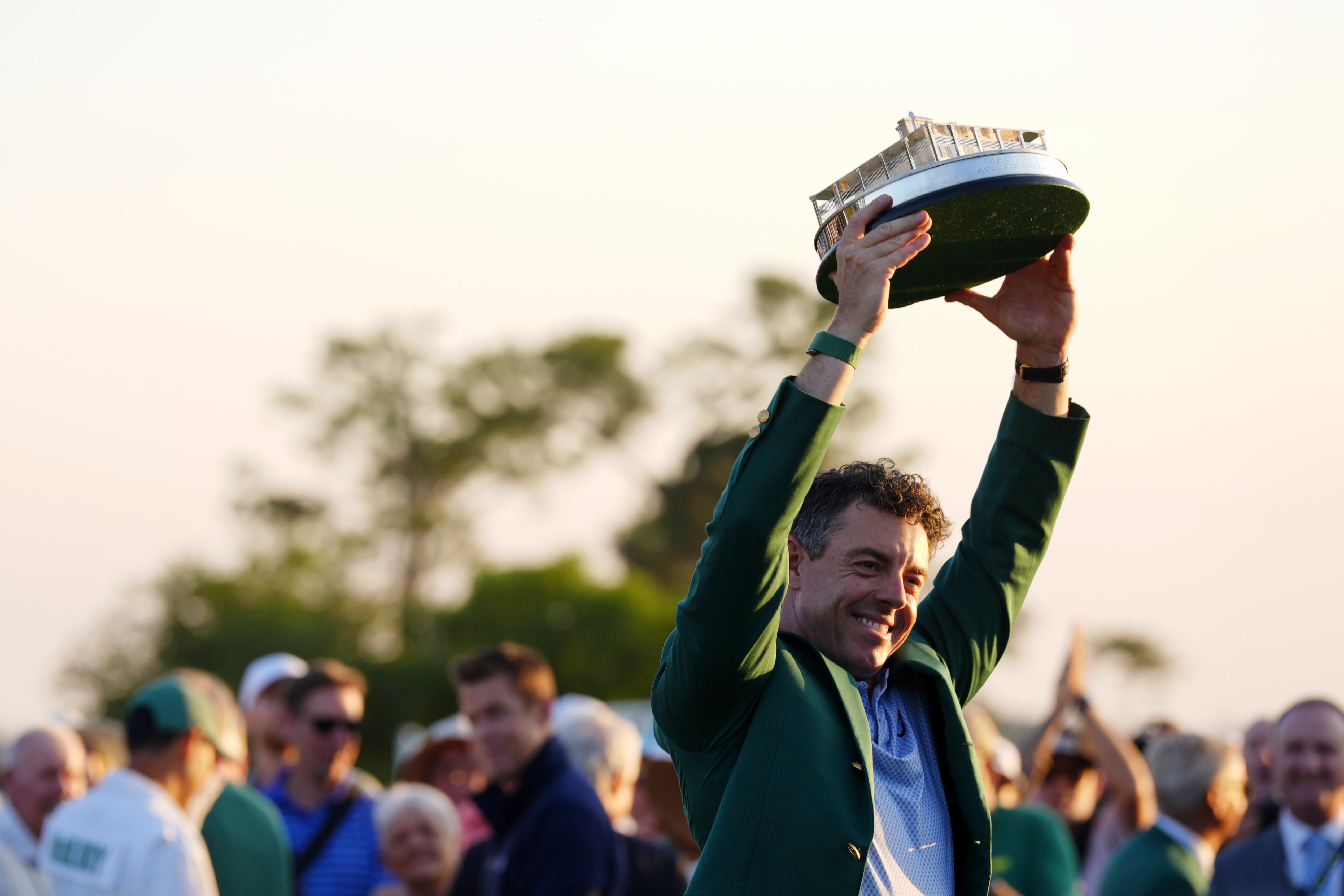 Apr 12, 2026; Augusta, Georgia, USA; Rory McIlroy holds the Masters championship trophy during the green jacket ceremony after the final round of the Masters Tournament at Augusta National Golf Club