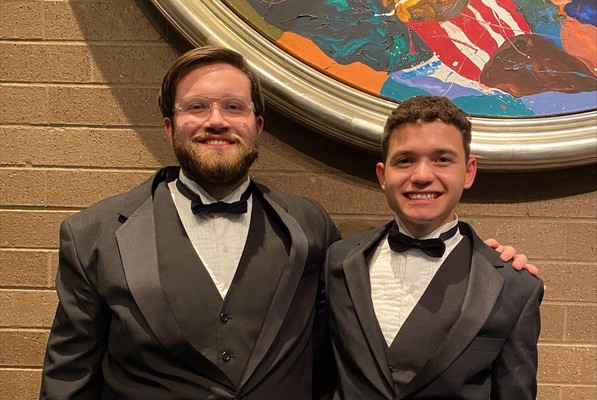 Representation of the achievement named 'Woosley and Packman participate in Kentucky Intercollegiate Band'.