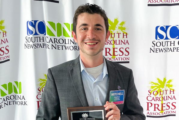 Representation of the achievement named 'Mitchell Mercer named 'Journalist of the Year' '.