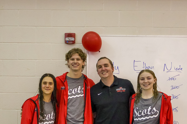 Seniors Cally Tate, Ethan Main and Nicole Fitch with head coach Jake Dacus.  (Caiden Crites/Monmouth College)