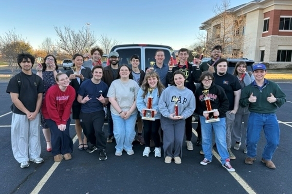 Representation of the achievement named 'Speech and Debate Earns Back-to-Back Championships'.