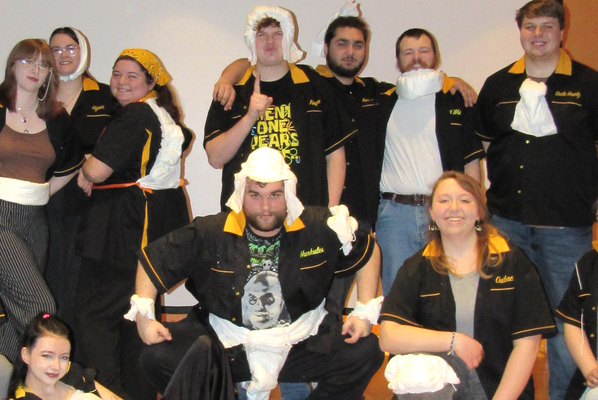 Members of EIU RSO’s Hello Dali Improv Comedy Troupe, adorned here with “absorbent accoutrements” before one of the group’s themed shows earlier this March. Members of Hello Dali are eager to provide laughs, spontaneity, and pure theatrical fun at the troupe’s remaining improv shows this spring on EIU’s Charleston, Illinois campus. Pictured here are current Hello Dali members (back row from left) Zack Evans, Hello Dali president Charlie Stauffer, Evelyn Bogard, Jo Mitchell, Tim Anderson, Michael Fellows, Brenden Cash, Hello Dali treasurer Ethan Lane, and Jay Larson; (front row from left) Mitch Cox, Hello Dali vice president Azlynn Padderatz, Myles Wright, Hello Dali secretary Abby Hill, and Hello Dali social media manager Olivia Keys. Fox Woods, not photographed, is also a part of the active lineup.