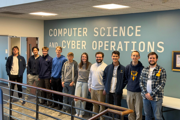 Representation of the achievement named 'Not Yet a Graduate, Already a Champion: Dual Enrollment Student Helps Win Cyber Title '.