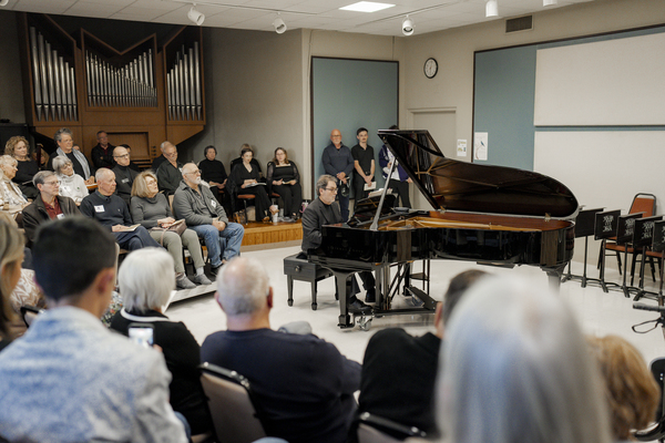 Dr. Keith DeFoor performs on one of the donated Steinway pianos at the dedication ceremony.