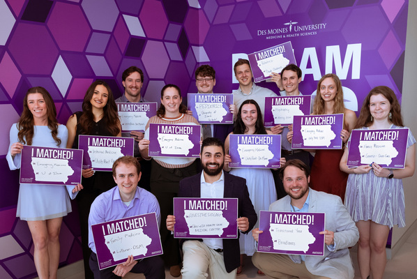 DMU College of Osteopathic Medicine students with residency matches in Iowa pose for a group photo on Match Day.