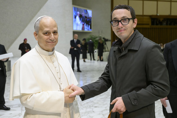 Representation of the achievement named 'Mountainburg's Michael Deel meets Pope Leo XIV while conducting research at the Vatican'.