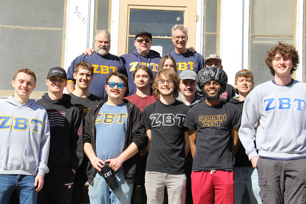HELP A BROTHER OUT: Nearly a dozen members of Monmouth's Zeta Beta Tau chapter turned out March 28 to help Doug Liniger '87 (back row, far right) move his parents from the house they've lived in at 306 South A Street for the past 60 years.