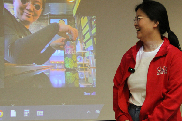JUDY WANG: With her iconic image in the background, the owner of Judy's Family Cafe in Galesburg tells her story to Monmouth's "Midwest Entrepreneurs" class.