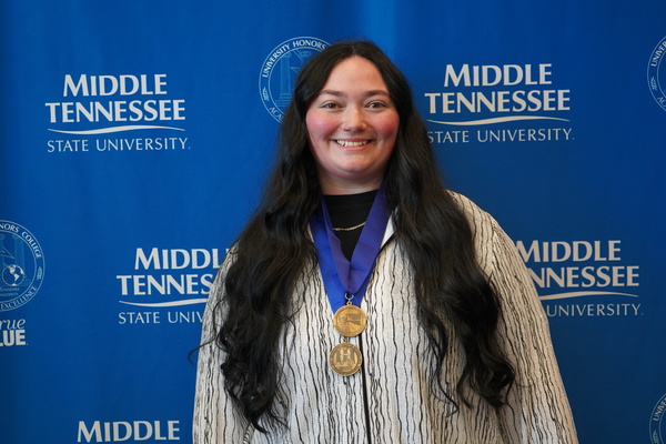 Representation of the achievement named 'Holly Olendorf successfully defends Honors thesis at MTSU'.
