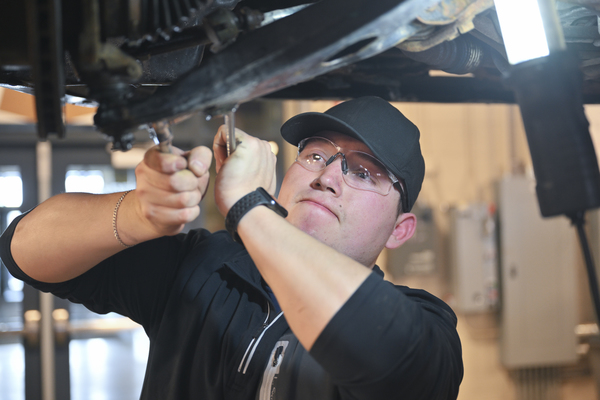 SUNY Canton student Byron Amaya of Maryland removes a sway bar link on a Subaru in the college’s Automotive Technology lab. 