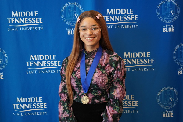 Representation of the achievement named 'Emma Turner successfully defends Honors thesis at MTSU'.
