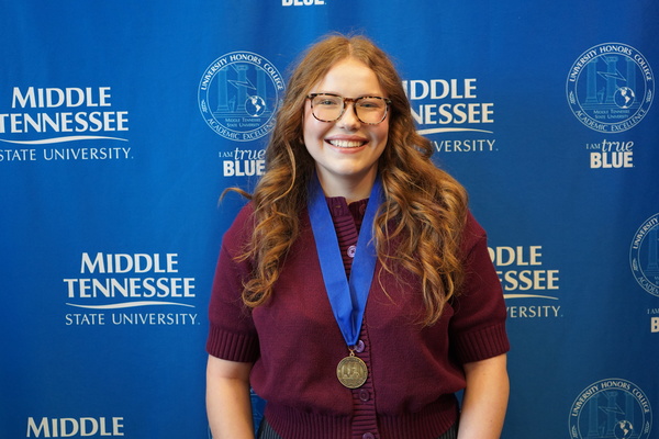 Representation of the achievement named 'MacKenzie Chambers successfully defends Honors thesis at MTSU'.