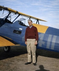 U.S. Army Air Corps flying cadet Joseph L. Burke poses in front of a Sterman PT-17 basic flight trainer during his flight training. 