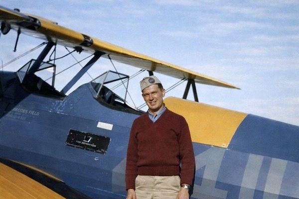 U.S. Army Air Corps flying cadet Joseph L. Burke poses in front of a Sterman PT-17 basic flight trainer during his flight training. (Courtesy John Burke)
