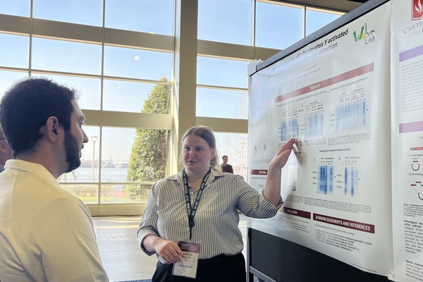 Representation of the achievement named 'Kaitlyn Sander presents research at conference'.