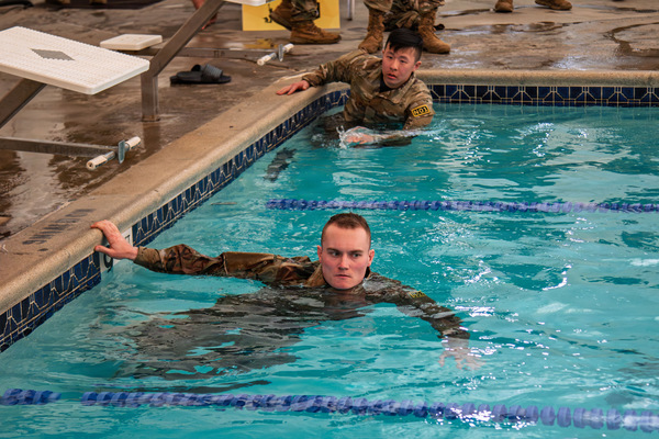 Army National Guard Staff Sgt. Derek Tucker, a member of the 105th Military Police Company and a Corning resident, competes in the swimming portion of the German Armed Forces Badge for Military Proficiency during the New York Army National Guard Best Warrior Competition, in New Windsor, N.Y., Mar. 24, 2026. (U.S. Army National Guard Photo by Sgt. Gianna Elle Sulger)