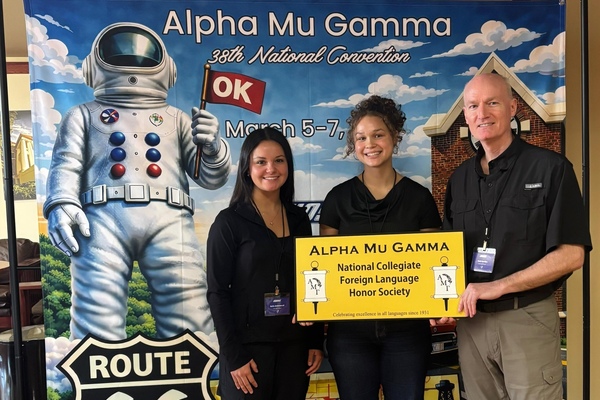 Representation of the achievement named 'Carthage College students present at National Convention of Alpha Mu Gamma'.