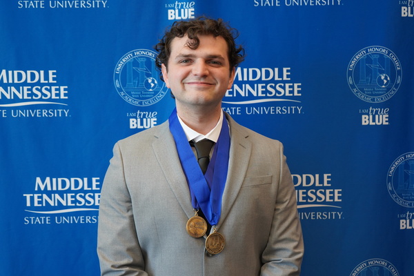 smiling man wearing medals