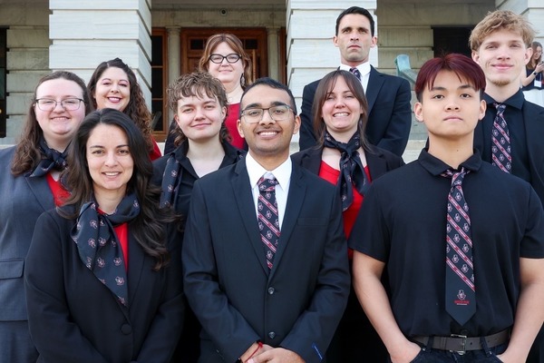 Students pose for a photo in front of the Capitol. Also pictured are Kelly Pitts, Dr. Amy Thompson, and Dr. Frank Ferdik.