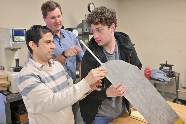 Pictured (l to r) are SUNY Canton Associate Professor Saied Haji Ghasemali, Ph.D., with Civil and Environmental Engineering Technology students Brett Miller of Potsdam and Seth Thomas of Canton. The trio is examining a sample similar to the one tested at the American Concrete Institute’s annual competition. 