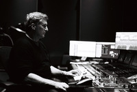 Person at a sound mixing board.